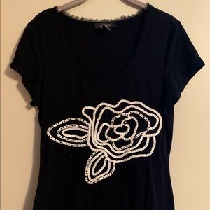 WHBM Size Med black short-sleeves tee w/ floral pattern & neckline detail.